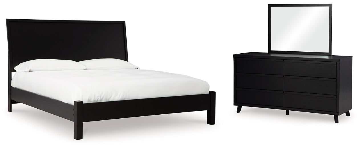 Danziar King Panel Bed with Mirrored Dresser